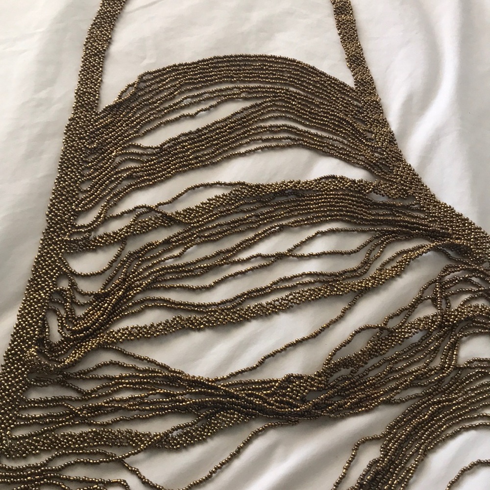 Dark gold shirt accessory